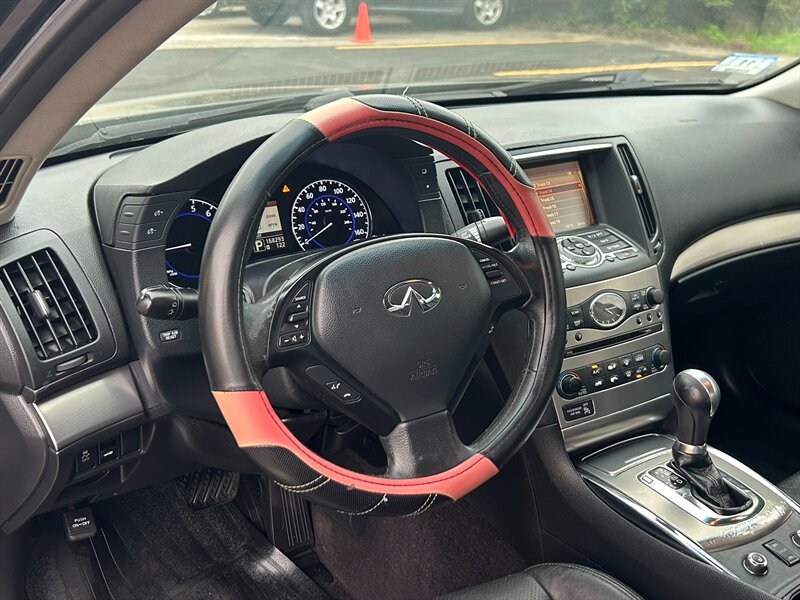Steering wheel, dashboard and gauge cluster of a vehicle on the M & Son lot in Windham, Maine
